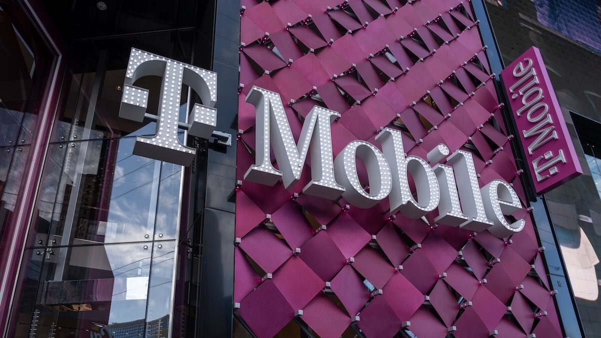 T-Mobile headquarters with digital lock icon and breach alert overlay