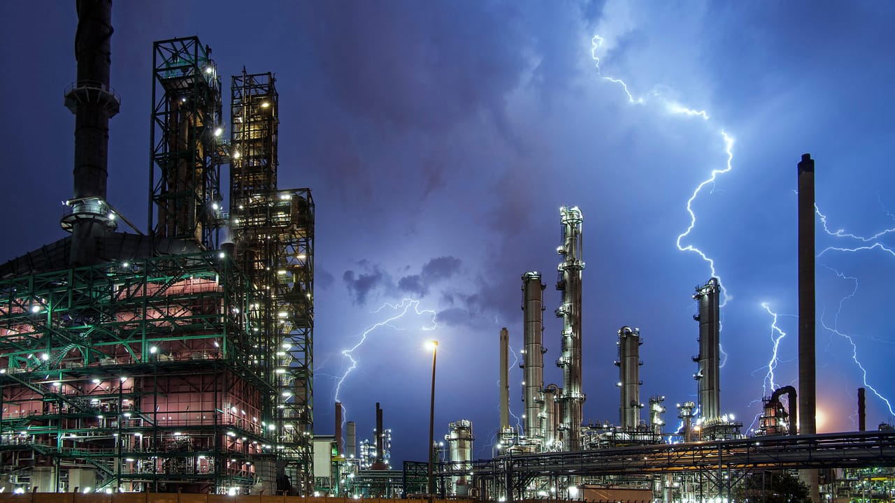 Digital assembly line depicting hackers scaling social engineering attacks on NPM maintainers like the Axios incident