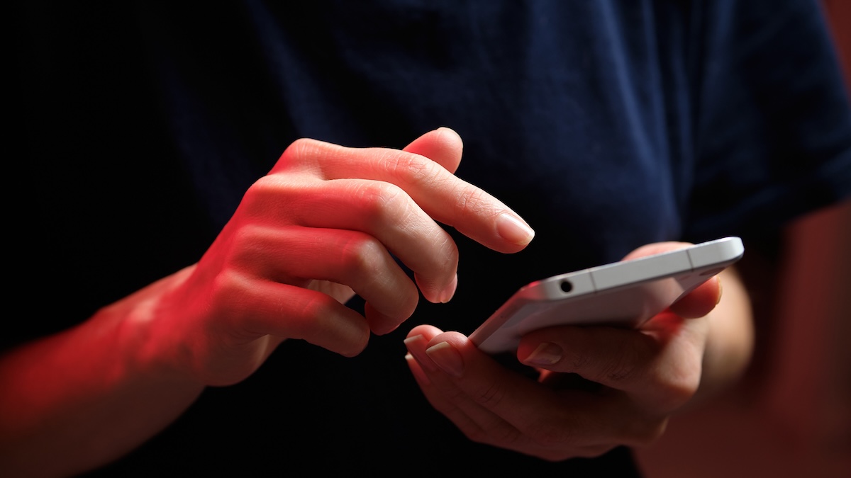 A smartphone screen showing a distorted notification feed with a red alert symbol overlay.