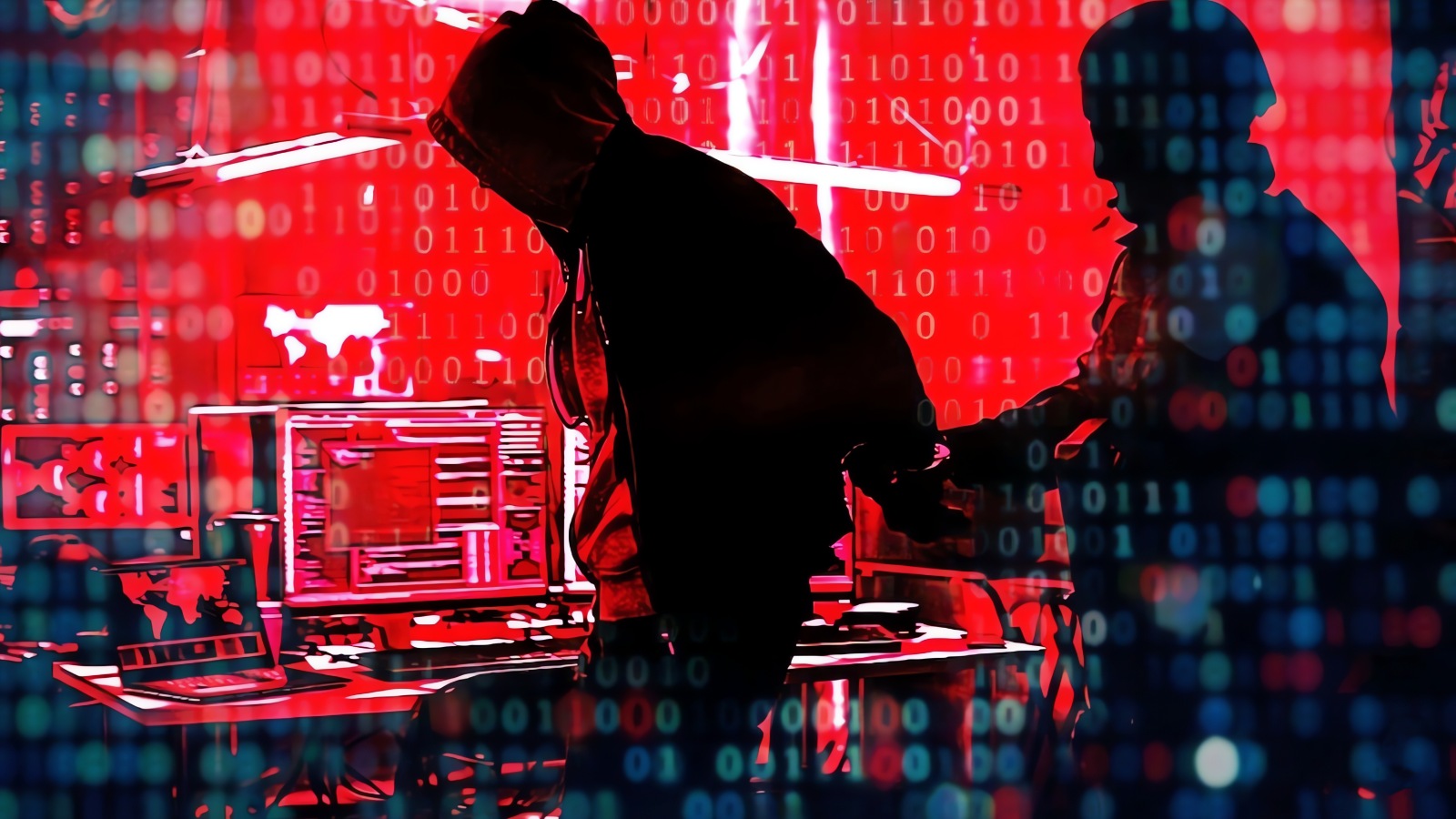 Law enforcement officers examining computer equipment in a dark room, symbolizing a cybercrime investigation.