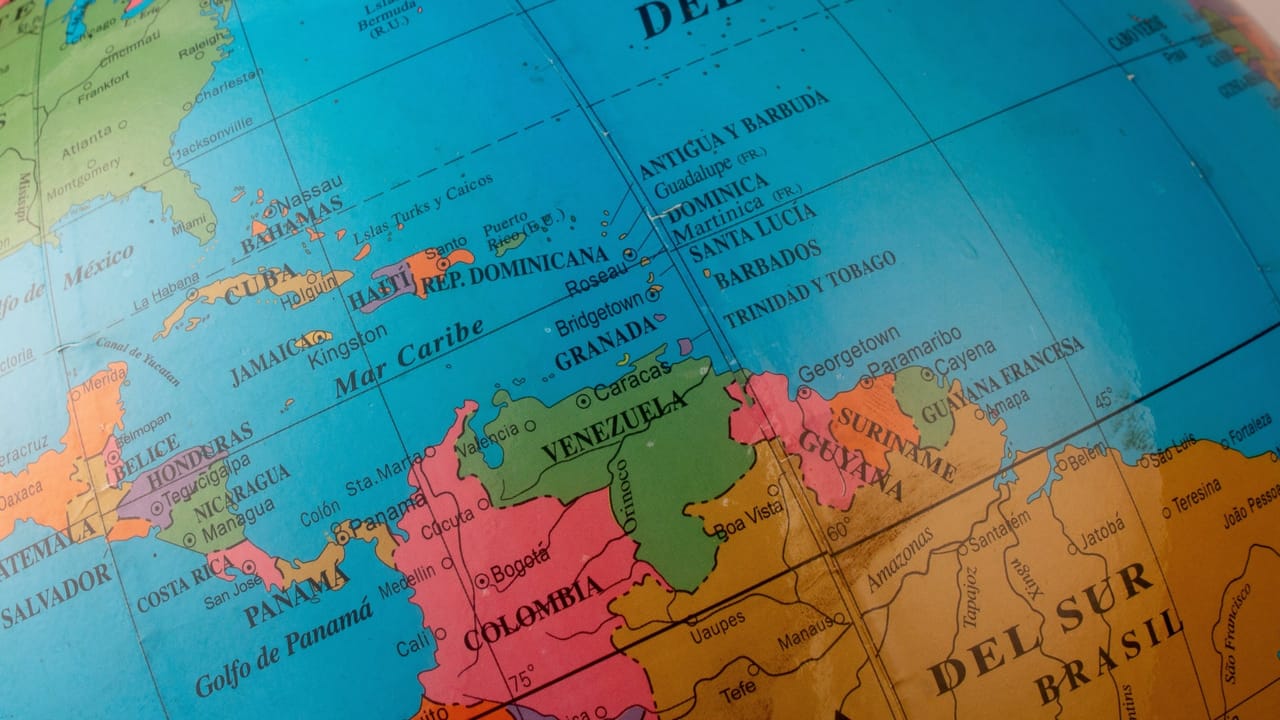 A digital lock icon superimposed over a map of Latin America, symbolizing a data security breach.